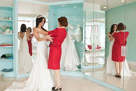 An elegant satin ball gown with a big skirt and fancy top with pearls on the skirt. The Dos And Don Ts Of Choosing Your Wedding Dress Glamour
