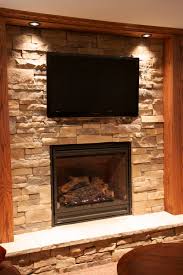 The dark wall of cabinets featuring a ribbon fireplace below the tv allows for a subtle decor element within a stunning forceful wall. Stone Fireplaces With Tvs North Star Stone