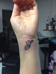 Getty images / design by dion mills thinking about getting a new—or your first—tat. N And S Letter Tattoo Designs On Hand
