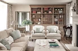 A blue leather ottoman coffee table is perfect for relaxing after a hard day at work or for entertaining guests. Discover How This Heritage Farm Was Transformed Into A Family Home Home Home Remodeling Cottage Interiors