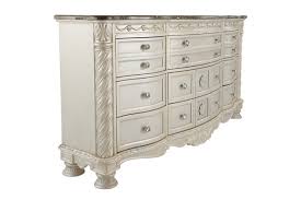 Acanthus leaf appliques take the generously scaled headboard and footboard to the ultimate level of style. Cassimore North Shore Pearl Silver And Dark Brown Dresser