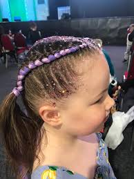 We are currently here and keep seeing the girls walking around with plats  and different colours in their hair. Does anyone know where you get it  done? Haven't managed to come across