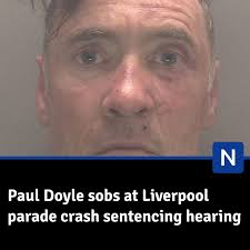 Doyle appeared emotional at Liverpool Crown Court as his sentencing hearing  began for the crash that injured more than 100 people in May