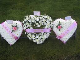 Solid double heart funeral flowers. Jacaranda Flowers Hearts Cushions Pillow Funeral Tributes