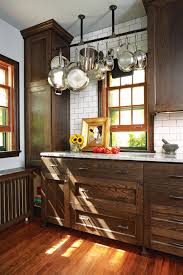 Old World Meets Industrial In South Minneapolis Brown Kitchen Cabinets Dark Brown Kitchen Cabinets Kitchen Design