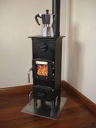 The possibility to see burning fire in such a small cooking stove is an amazing idea. Awesome Min Stove Http Www Mas Des Saules Co Nz Workshop Giovanni Stoves Html Tiny Wood Stove Tiny House Appliances Tiny House Living