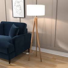 For example, a living room with a tripod floor lamps are suitable for room corners but they can also be used in a variety of other ways. Tripod Floor Lamp In Wood With White Shade Whenby Furniture123