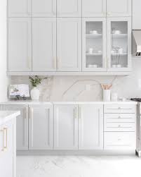 Light grey matte lacquer kitchen cabinets were combined with storage units that open to reveal in a mexican home nestled in the trees the grey kitchen cabinetry vent hood and table are by boffi. Renowow A Beautiful Grey Kitchen With Gold Hardware And Facebook