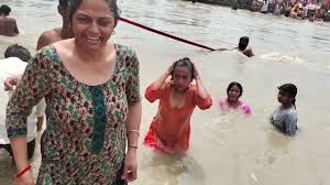 Captivating Curves: Ganga River Bathing Women