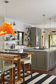 The cloud white kitchen island and perimeter cabinets blend seamlessly with the white subway tile backsplash, while the small area of wall painted in benjamin moore silver satin adds just the right amount of dimension to the space. Benjamin Moore Chelsea Gray Kitchen Cabinets Novocom Top