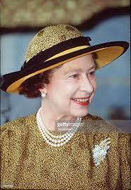 Queen Elizabeth Ll Wearing A Mauve Straw Hat Decorated With Violets Queen Elizabeth Queen Hat Queen