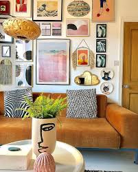 Crazy Gallery Wall In This Eclectic Living Room Eclectic Living Room House Interior Boho Living Room