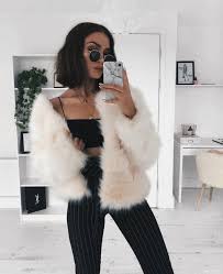 Black And White Faux Fur Coat Black Crop Top And High Rise Pants With A White Faux Fur Coat Visit Daily Dress Me At Dailydressme Com For More Ins Fashion Fall Fashion Coats Fashion Outfits