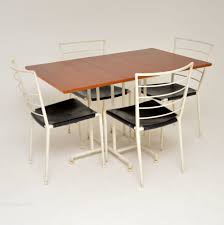 The geometric base, an artful junction of dramatically raked legs, balances a substantial top, lending a striking, architectural sensibility. Antiques Atlas 1960 S Ladderax Teak Dining Table 4 Chairs