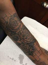 3 Black Roses With Brick Wall Background Tattoo Forearm Sleeve Tattoos Left Arm Tattoos Half Sleeve Tattoos For Guys