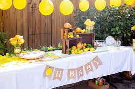 The sweets and treats table is styled with hanging puffs and polka dots. 50 Best Baby Shower Ideas Top Baby Shower Party Planning Ideas