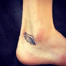 Cute And Small Angel Wing Design Tattoos On The Ankle Angel Wing Designs Tattoo Small Angel Wing Tattoo Ankle Tattoo Designs