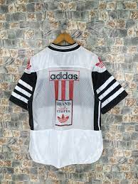 German sports brand known for three stripes answers. Vintage Adidas Trefoil Big Logo Mesh Jersey Medium 90 S Etsy Vintage Adidas 90s Sportswear Adidas Three Stripes