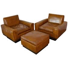 This chair does not appear to have been used, and the leather appears in so is this the eames 670 chair and the 671 ottoman from herman miller? Mid Century French Cognac Leather Club Chairs And Ottoman At 1stdibs