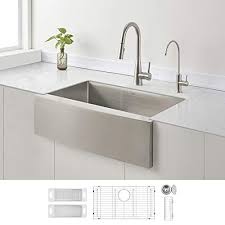 Stainless steel farmhouse sink with black faucet. Best Stainless Steel Farmhouse Sinks For 2021