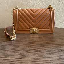 The bag features a ruthenium chain link shoulder strap with a leather shoulder pad and a ruthenium boy. Chanel Bags Chanel Quilted Boy Flap Medium Calf Skin Poshmark