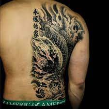 The Koi Fish Is One Of The Most Recognizable Asian Tattoos Discover The Legend Behind Them What Different D Back Tattoos For Guys Back Tattoos Asian Tattoos