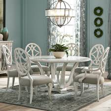 Gather with family and friends around the ashley valebeck table with 6 chairs. Trisha Yearwood Home Collection By Klaussner Jasper County Seven Piece Vintage Dining Set With Dogwood Round Table Darvin Furniture Dining 7 Or More Piece Sets