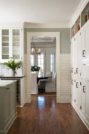 The black marble countertops pop against the traditional white cabinetry. Black Hardware Kitchen Cabinet Ideas The Inspired Room