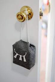 For the 14″ end, create a loose u shape and tuck the loose end into the closest seam between the loops. Diy Door Stop That Hangs From Your Door Knob Diy Candy