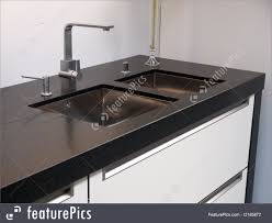 modern kitchen sink with tap faucet
