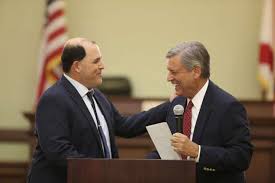 Giant shoes to fill': Daniel Eisinger sworn in as Palm Beach County's new  public defender