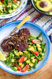 Beef Burgers With Jerk Onions Cucumber Avocado Salad