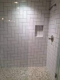Hold each tile sheet straight across the top and set down your spacers before pressing tile firmly and evenly into the mortar. This Is Another Pattern We Do A Lot Straight Herringbone This Is With A 4x10 Subway Modern Bathroom Remodel Herringbone Tile Bathroom Loft Bathroom