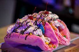 Unicorn Tacos Are Pictured On Monday Apr 1 2019 At Jake S Unlimited In Mesa Ariz The Dessert Is Made With A Cott Ice Cream Taco Food Dark Chocolate Cakes