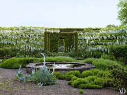 Experience Spring At England S Petworth House Architectural Digest Gravel Garden Pergola Garden Wisteria Pergola