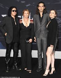 Gene simmons net worth and salary: Kiss Singer Gene Simmons 69 Poses For Very Rare Family Portrait As He Shows Off Playboy Model Wife Daily Mail Online