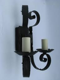 Wall sconce lights typically have compact mountings that keep the fixture close to the wall or mounting surface. Gothic Medieval Castle Black Wrought Iron Vintage Twin Light Wall Sconce Lamp