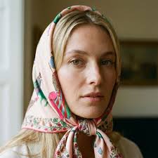 MONIK — silk scarves transformed into wearable art. Each accessory flows  like a moving canvas, where colours shift with the light and every fold  tells a story. A scarf to wear your