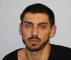 Man Allegedy Kicks Cop After Refusing to Pose for Mugshot: Log