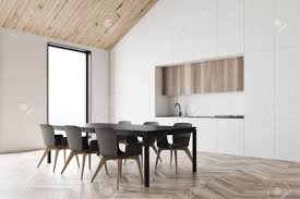 Find modern dining chairs as dashing as the table itself. Corner Of Comfortable Attic Kitchen With White Walls Wooden Stock Photo Picture And Royalty Free Image Image 140252074
