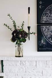 Using candles of varying sizes, colors, styles, and shapes brings more variation in the arrangement. Charming Inexpensive Decorating Non Electric Wall Lights With Battery Candles The Inspired Room