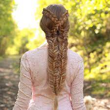 In the hairstyle department, braids are king. Mia Linda On Instagram Criss Crossed Dutch Lace Braids Into Stiched Fishtails Hair Styles Braided Hairstyles Long Hair Styles