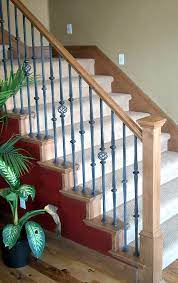 The foot of the bed has curved spiral wrought iron beams which add a softer look to the sturdy. Add A Wood Handrail To Your Wrought Iron Balustrade Stair Makeover