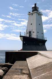 The Ludington Light Is A 57 Foot 17 M Tall Steel Plated Lighthouse In Ludington Michigan Which Lies Along The Easter Lighthouse Ludington Lighthouse Keeper