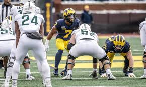 In football, the offense has a limited number of downs, or plays, in which to move the ball at least ten yards. Michigan Football Khaleke Hudson Punt Blocking