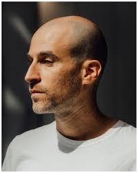 A couple portraits of Joshua Frankel at Moynihan Train Hall and a snippet  from his animation, “Within the crowd there is a quality,” which will be  projected