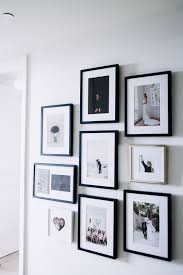 Styling A Chic Photo Wall Wedding Picture Walls Wedding Photo Wall Display Photo Wall Display