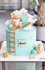 Covered in buttercream and decorated with ombre buttercream petals. 15 The Cutest First Birthday Cake Ideas 1st Birthday Cakes