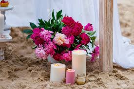 However, you can't display your flowers right next to a burning candle. Beautiful Delicate Wedding Decorations With Candles And Fresh Flowers On The Beach Stock Photo Picture And Royalty Free Image Image 60884212