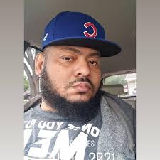 Simone Biles wearing a Packers hoodie at Soldier Field